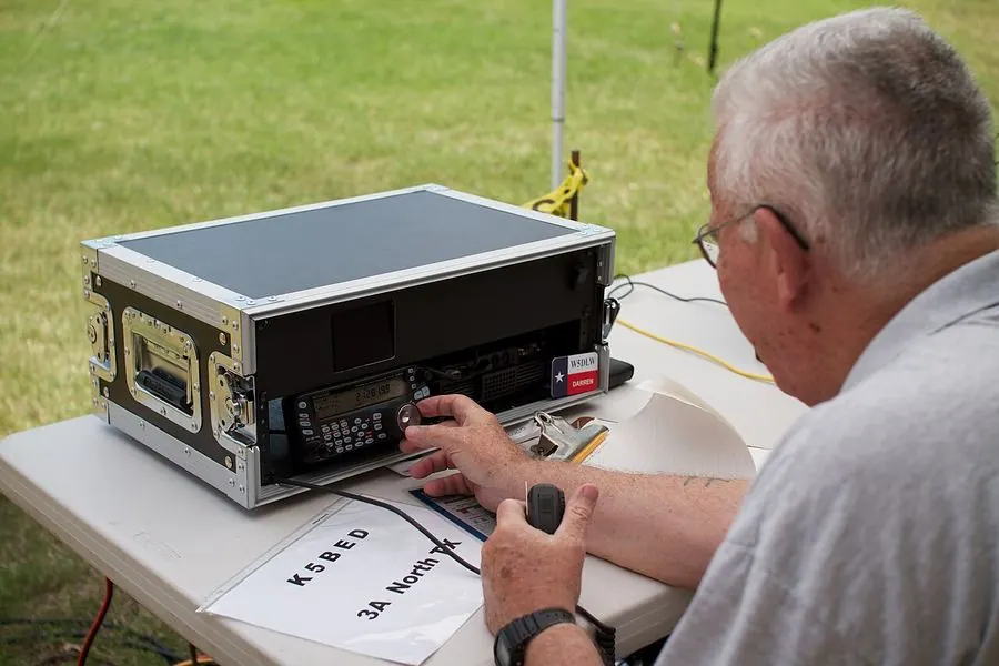 An operator sending code at a portable Field Day station